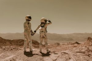 astronauts walking on the sand
